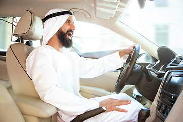 Image showing Arabian saudi businessman driving hir car