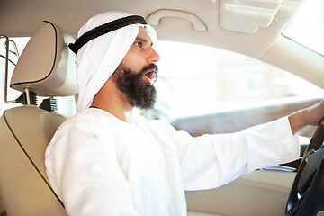 Image showing Arabian saudi businessman driving hir car