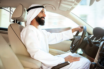 Image showing Arabian saudi businessman driving hir car