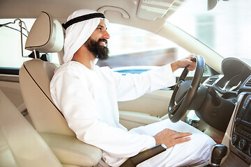 Image showing Arabian saudi businessman driving hir car