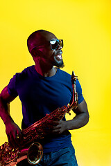 Image showing Young african-american jazz musician playing the saxophone