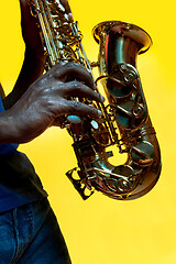 Image showing Young african-american jazz musician playing the saxophone