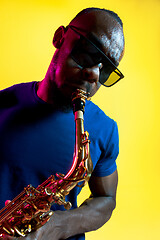 Image showing Young african-american jazz musician playing the saxophone