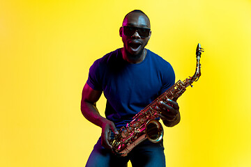 Image showing Young african-american jazz musician playing the saxophone