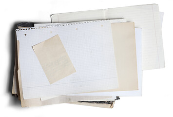 Image showing Sheet of square paper on pile of aged papers