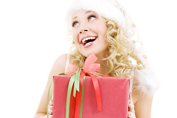 Image showing cheerful santa helper girl with gift box