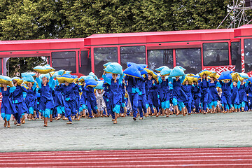 Image showing Dancers in blue costumes perform at the Grand Folk dance concert