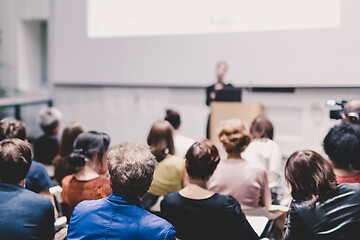 Image showing Female speaker giving presentation on business conference.