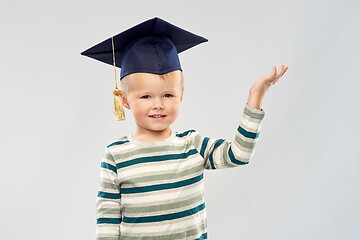 Image showing little boy in mortar board with empty hand