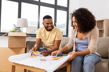 Image showing couple with blueprint and color palettes at home