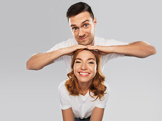 Image showing portrait of happy couple in white t-shirts