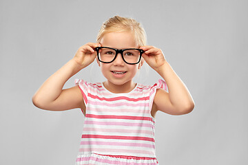 Image showing smiling cute little girl in black glasses