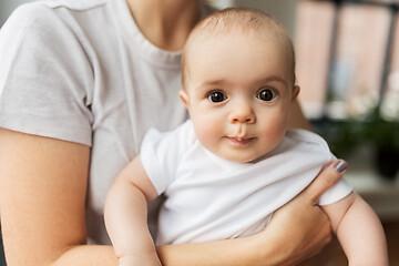 Image showing close up of mother holding little baby daughter