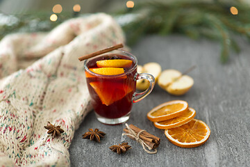 Image showing glass of hot mulled wine with orange and cinnamon