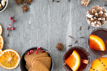 Image showing hot mulled wine, orange slices, raisins and spices