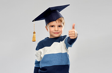 Image showing little boy in mortarboard showing thumbs up