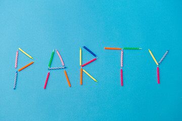 Image showing word party made of birthday candles on blue