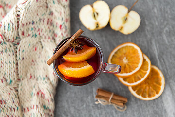 Image showing glass of hot mulled wine with orange and cinnamon