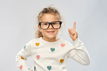 Image showing portrait of girl in glasses pointing finger up