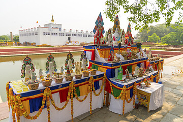 Image showing Buddha birthplace in Lumbini and buddhist offerings 