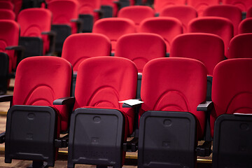 Image showing hall with rows of red seats