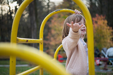 Image showing cute little girl  having fun in playground
