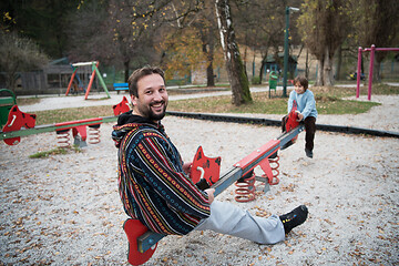 Image showing father and  child having fun together  in park