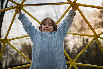 Image showing cute little boy having fun in playground