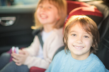 Image showing kids  sitting together in modern car