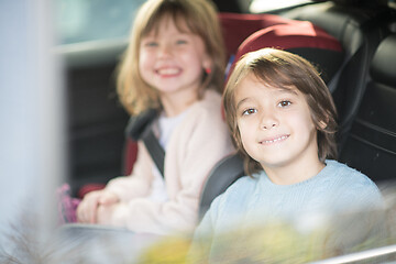 Image showing kids  sitting together in modern car