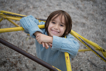 Image showing cute little boy having fun in playground