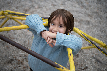 Image showing cute little boy having fun in playground