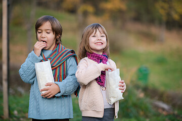 Image showing kids in park eating popcorn in park