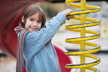 Image showing cute little boy having fun in playground