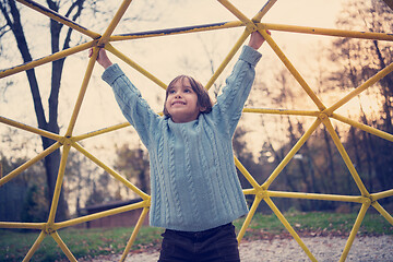 Image showing cute little boy having fun in playground