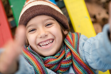 Image showing cute little boy having fun in playground