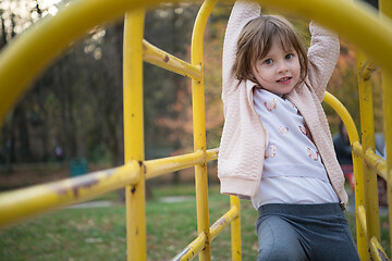 Image showing cute little girl  having fun in playground