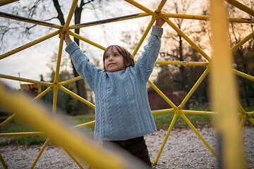 Image showing cute little boy having fun in playground