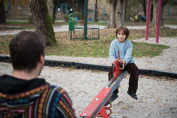 Image showing father and  child having fun together  in park