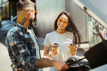 Image showing Young couple preparing for vacation trip on the car in sunny day