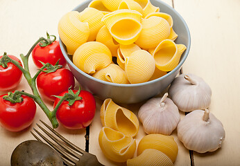 Image showing Italian snail lumaconi pasta with tomatoes