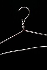 Image showing simple metal hanger on a black 