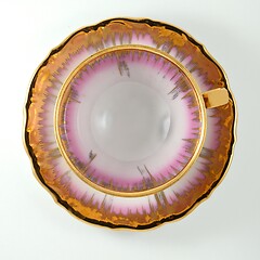 Image showing empty porcelain tea cup with gilding on a white backdrop, view f