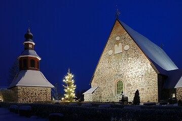 Image showing christmas night scenery in Finland, church in snow, xmas tree