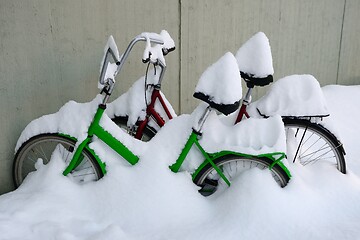 Image showing two snow covered bikes in winter