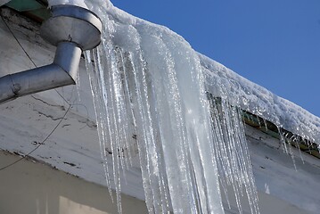 Image showing large icicles hanging from the roof