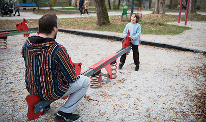 Image showing father and  child having fun together  in park