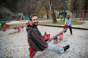 Image showing father and  child having fun together  in park