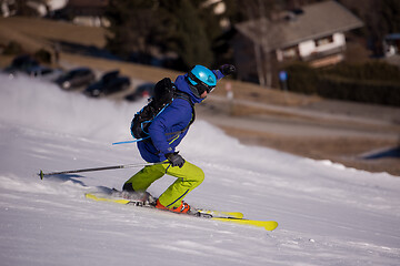 Image showing Skier having fun while running downhill