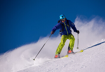 Image showing Skier having fun while running downhill